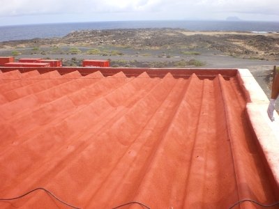 Encapsulado de cubiertas de fibrocemento con partículas de amianto